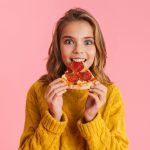 kid eating pizza