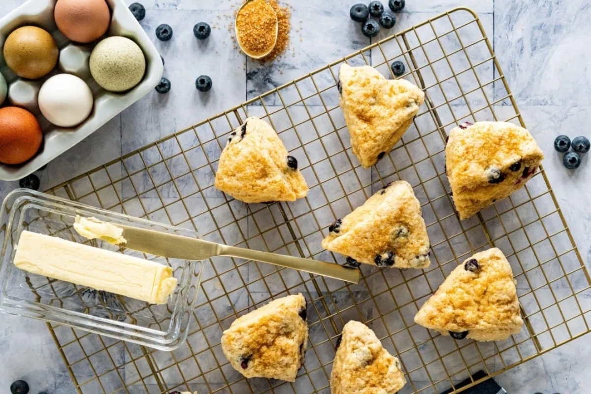 Blueberry scones on a cooling rack.