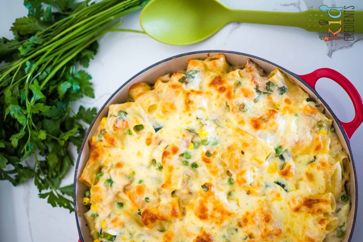 Cheesy tuna bake in a skillet with parsley.