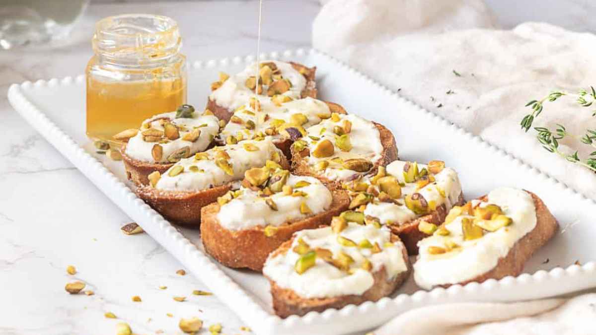 Whipped Ricotta Crostini With Honey And Pistachios.