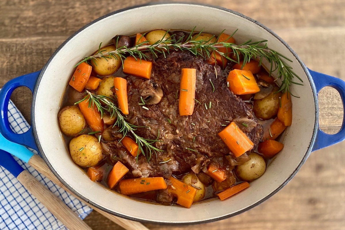 Beef stew with carrots and potatoes in a pot.