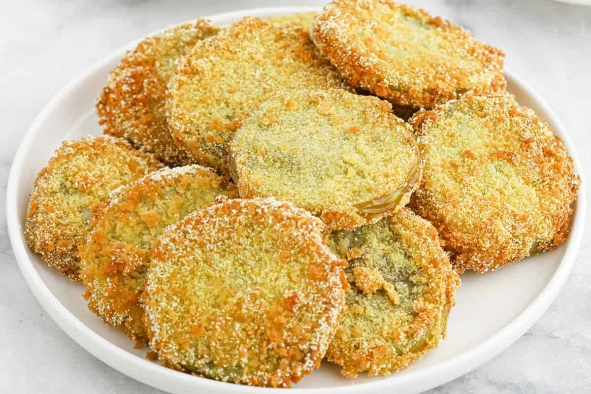 Fried green tomatoes on a white plate.