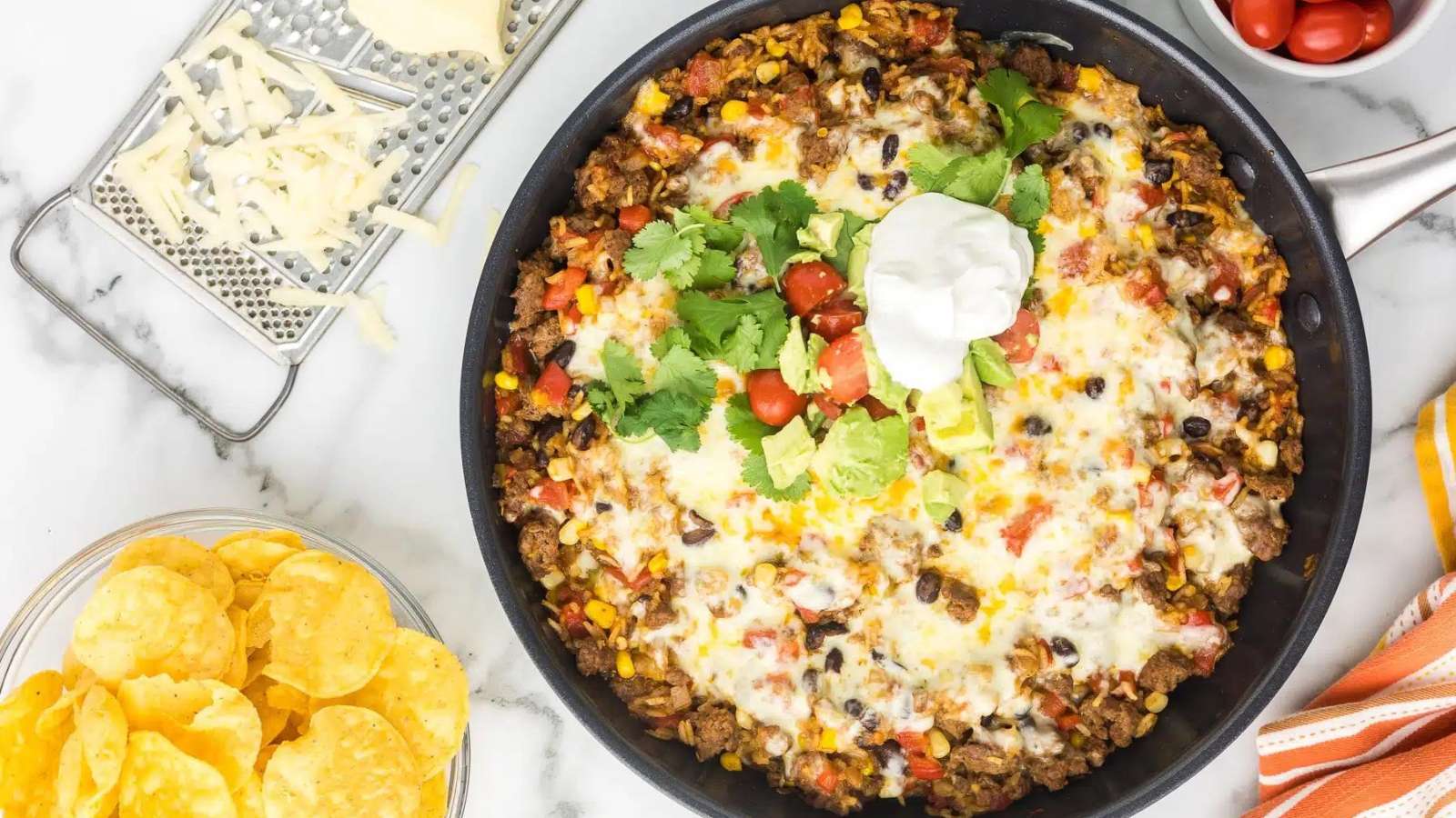 39 Rice Dishes That Are Perfect for Dinner and Even Better Leftover 26 One Pot Cheesy Taco Skillet recipe by Cooking Up Memories.