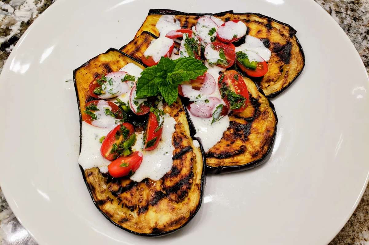Grilled Eggplant With Tomatoes And Yogurt Sauce.