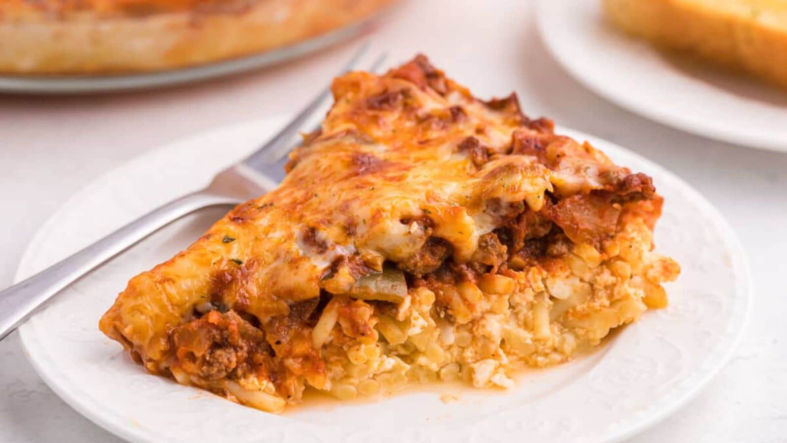 Easy Baked Spaghetti Pie recipe by Simply Stacie.