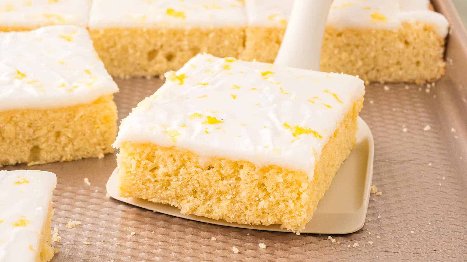 59 Divinely Delicious Desserts Perfect For Your Next Church Social 26 Glazed German Lemon Sheet Cake recipe by Cheerful Cook.