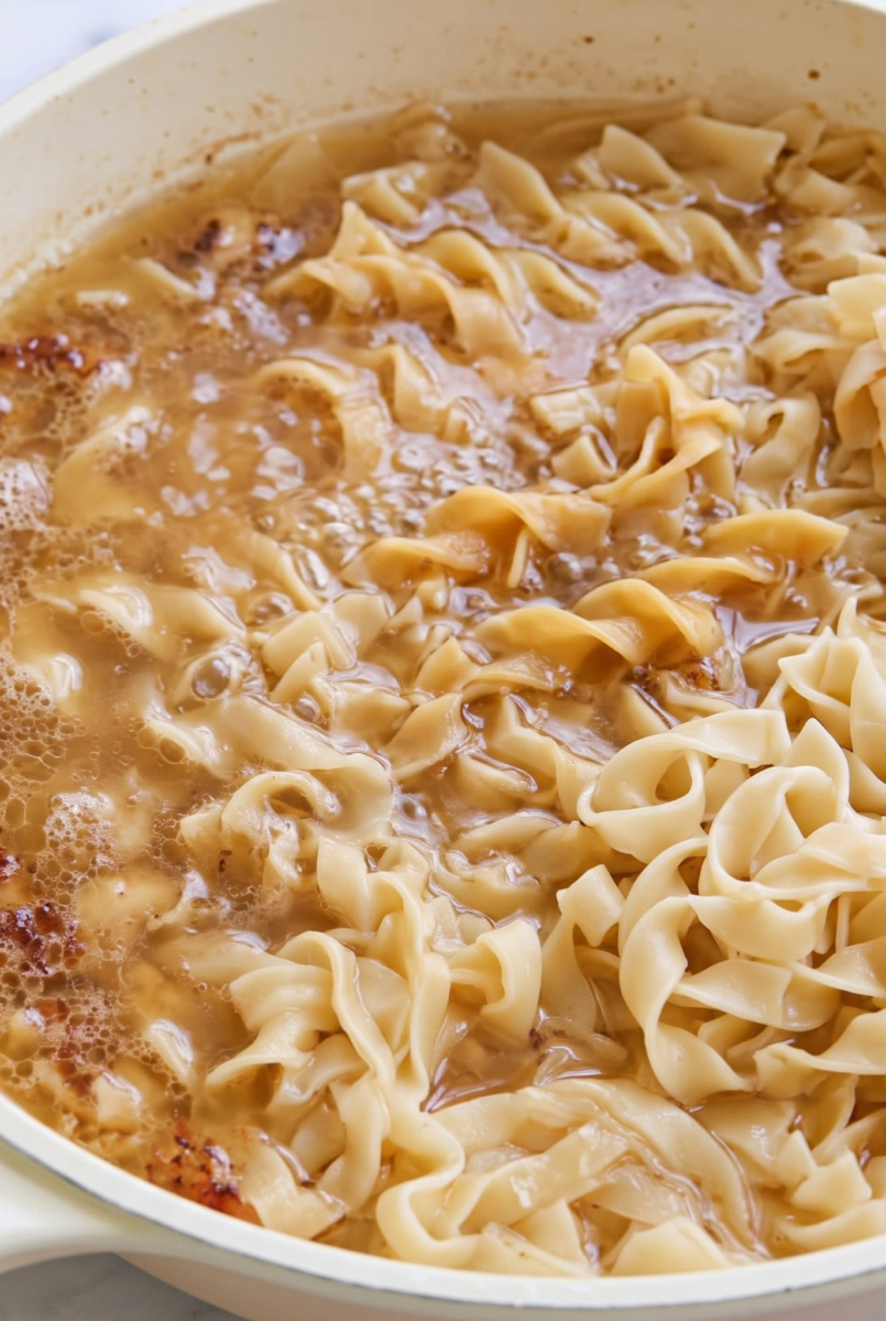 Easy One-Pan Buttery Chicken and Noodles 5 skillet filled with buttery chicken and noodles ip2